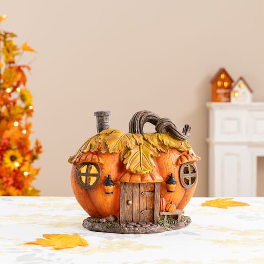 Glitzhome® 8.5" Lighted Fall Resin Pumpkin House Table Decor with Timer